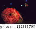 Japanese umbrella illuminated at night 111353795
