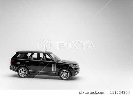 car insurance. black toy car isolated 111354564