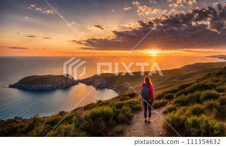 Girl with backpack standing atop a cliff overlooking a vast ocean captured 111354632