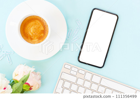 Home office desk with phone on blue Home office desk with phone on blue 111356499