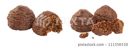 chocolate cookie with kerob, banana, cashew, sunflower seeds and coconut paste isolated on white background. Healthy food, gluten-free, flour-free chocolate cookie with kerob, banana, cashew, sunflower seeds and coconut paste isolated on white background. Healthy food, gluten-free, flour-free 111356538