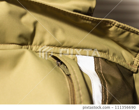 Khaki workwear protective clothing reflector inserts close-up details. 111356690