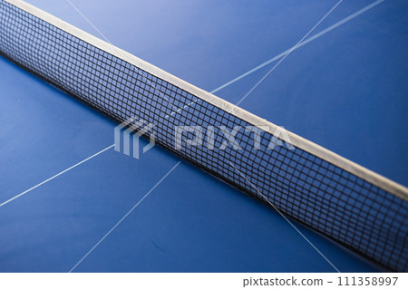 Closeup of net on blue table for ping-pong. The concept of sport and healthy lifestyle. Table tennis 111358997