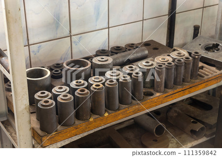 Set of different instruments on shelves in big workshop. Set of different instruments on shelves in big workshop. 111359842