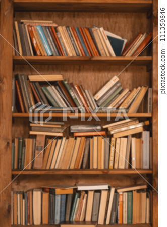 Shelf Filled With Old Books, Vintage Charm And Nostalgic Appeal Of Aged Literature. Weathered Book Spines And Aged Pages, Evoking Sense Of History And Literary Heritage. Vertical Close-Up Shot. High 111359846