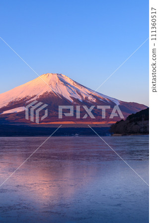 Spectacular view of upside-down Fuji reflected in Lake Yamanaka, Yamanashi Prefecture (Red Fuji) Spectacular view of upside-down Fuji reflected in Lake Yamanaka, Yamanashi Prefecture (Red Fuji) 111360517