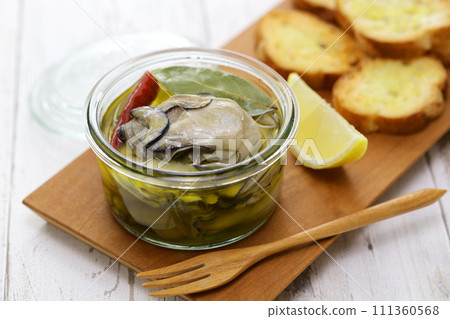 Homemade oysters marinated in olive oil Homemade oysters marinated in olive oil 111360568