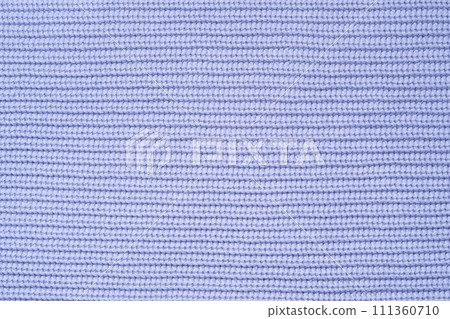 Blue knitted background from woollen yarns or cotton. Abstract texture of a knitted fabric surface. 111360710