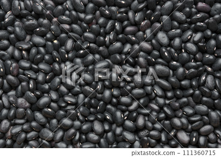 Black beans background. Texture of black bean grains, top view. Black beans background. Texture of black bean grains, top view. 111360715