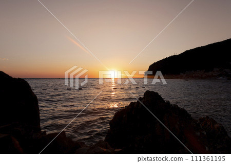 Beautiful sunset at the horizon at sea 111361195