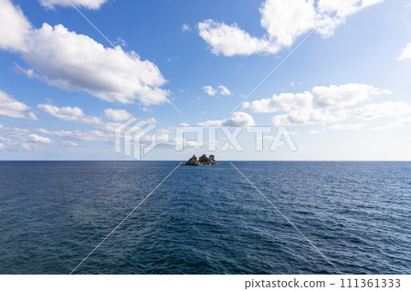 View of island called Sveta Nedelja (St. Sunday) near Petrovac, Montenegro and blue sky with white fluffy clouds View of island called Sveta Nedelja (St. Sunday) near Petrovac, Montenegro and blue sky with white fluffy clouds 111361333
