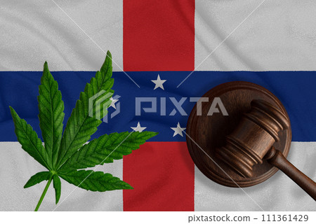 Judicial wooden gavel, fresh hemp leaf and flag of Netherlands Antilles Illegal sale and distribution of marijuana Judicial wooden gavel, fresh hemp leaf and flag of Netherlands Antilles Illegal sale and distribution of marijuana 111361429