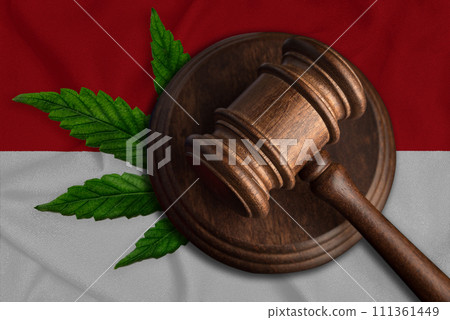 Judicial wooden gavel, fresh hemp leaf and Monaco flag. Illegal sale and distribution of marijuana Judicial wooden gavel, fresh hemp leaf and Monaco flag. Illegal sale and distribution of marijuana 111361449