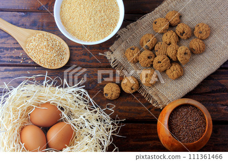 homemade gluten free and lactose free cookies on rustic wooden table with ingredients homemade gluten free and lactose free cookies on rustic wooden table with ingredients 111361466
