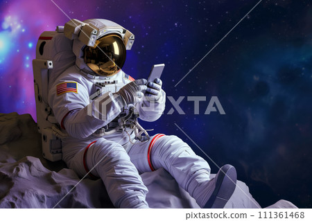 Astronaut using smartphone sitting on an alien planet surface with space background 111361468