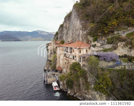 Drone view at the monastery of Santa Caterina del Sasso on lake Maggiore Italy 111361592