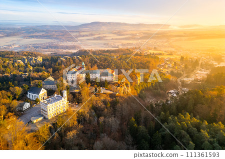 Hruba Skala chateau at cold morning sunrise time. Bohemian Paradise, Czech: Cesky raj, Czechia. Aerial view from above. 111361593