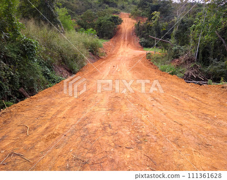 Open road ready for paving built for the development of deserted region 111361628