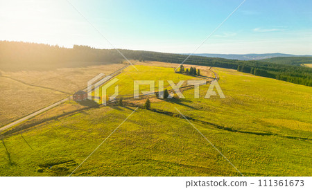 Blatna irrigation canal in the middle of autumn landscape at Ryzovna, Ore Mountains, Czech: Krusne hory, Czechia. Aerial view from drone. Blatna irrigation canal in the middle of autumn landscape at Ryzovna, Ore Mountains, Czech: Krusne hory, Czechia. Aerial view from drone. 111361673