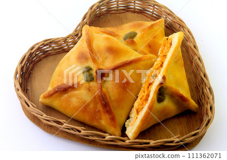 meat sfiha (esfiha) of arabic origin traditionally adapted for brazilian cuisine in the basket on white background 111362071