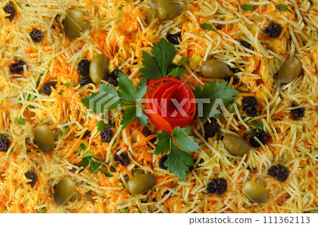 Salpicao is a typical Brazilian salad, made with shredded chicken, raisin, grated carrot, potato sticks and mayonnaise. Salpicao is a typical Brazilian salad, made with shredded chicken, raisin, grated carrot, potato sticks and mayonnaise. 111362113