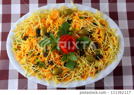 Salpicao is a typical Brazilian salad, made with shredded chicken, raisin, grated carrot, potato sticks and mayonnaise. 111362117