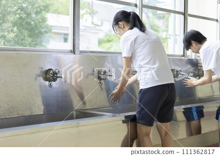 High school student washing hands High school student washing hands 111362817