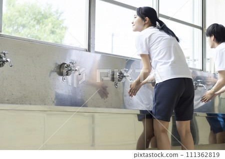 High school student washing hands High school student washing hands 111362819