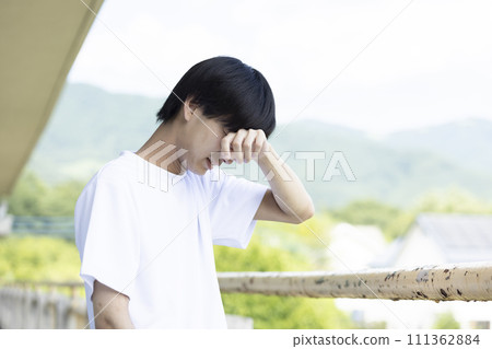 High school boy grieving High school boy grieving 111362884