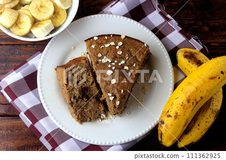 Healthy homemade banana cake made with oatmeal on rustic wooden table. sugar-free, milk-free, gluten-free 111362925
