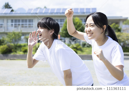 Students cheering in gym clothes Students cheering in gym clothes 111363111