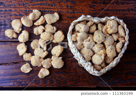 Soybean meat, chunks in a basket with heart shape. Raw soybeans chunks on rustic wooden background Soybean meat, chunks in a basket with heart shape. Raw soybeans chunks on rustic wooden background 111363199