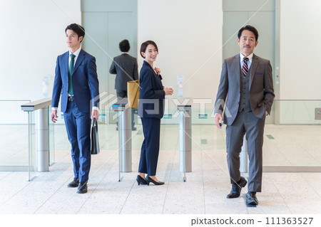 Portrait of a business woman passing through a security gate 111363527