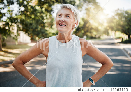Fitness senior woman with earphones and smartwatch for her outdoor exercise, listening to music or motivation podcast with 5g technology. Healthy elderly person or runner happy with workout results Fitness senior woman with earphones and smartwatch for her outdoor exercise, listening to music or motivation podcast with 5g technology. Healthy elderly person or runner happy with workout results 111365113