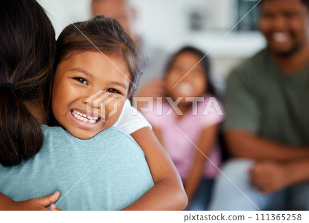 Family, Indian and girl hug mom with happy smile and laugh, excited at home. Love, laughing and men and women with kids in India. Fun, parents and kids relax on weekend, mother and daughter together 111365258