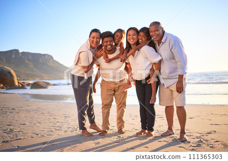 Big family, travel and children on beach vacation with parents and grandparents enjoying summer and fun tropical trip in Brazil together. Portrait of happy men, women and girl kids on holiday 111365303