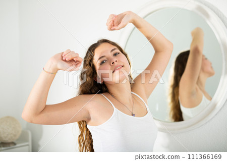 Young smiling woman under stretching 111366169