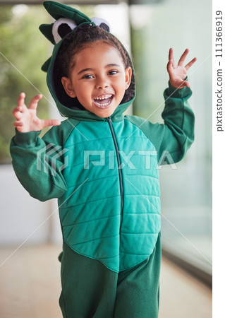 Child, halloween and playing role in costume in a living room at home and having fun being creative. Happy girl kid as fantasy dinosaur in character, smiling and excited to roar and play game Child, halloween and playing role in costume in a living room at home and having fun being creative. Happy girl kid as fantasy dinosaur in character, smiling and excited to roar and play game 111366919