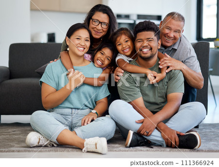 Big family portrait, children with grandparents with love, hug and smile together. Happy elderly mother, father and kids bonding together with adult children on the floor in the living room of house 111366924