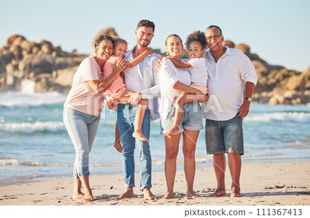 Happy family, portrait and beach summer vacation with happy people bonding on ocean trip. Freedom, love and sea travel with interracial family hug, laugh and walking in nature with excited children 111367413