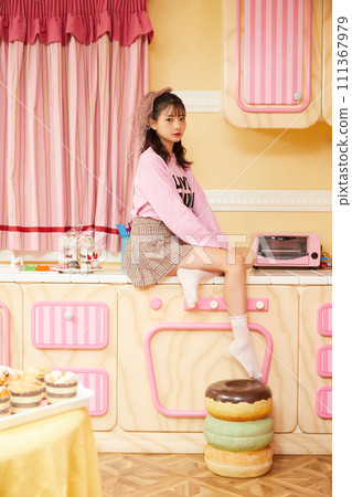 Retro portrait of young woman in pink outfit Retro portrait of young woman in pink outfit 111367979