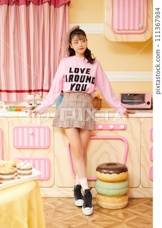 Retro portrait of young woman in pink outfit 111367984