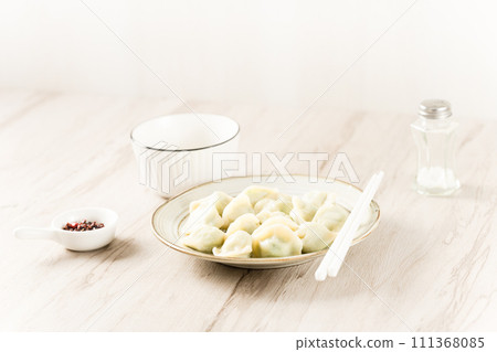 dumplings with red sauce 111368085