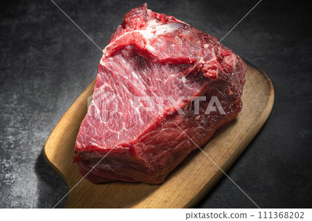 raw beef steak on a black background 111368202