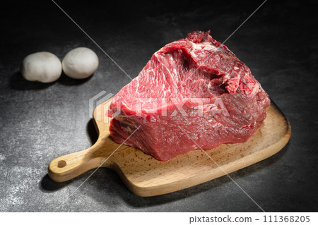 raw beef steak on a black background 111368205