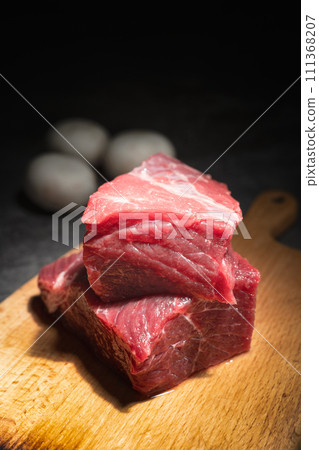 raw beef steak on a black background 111368207