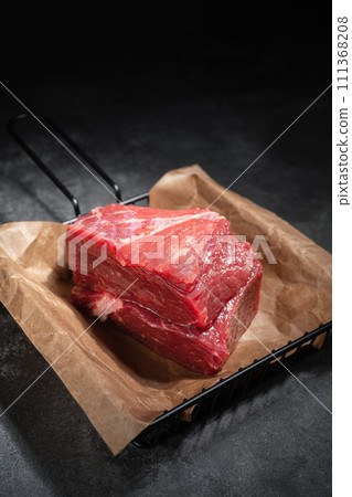 raw beef steak on a black background raw beef steak on a black background 111368208
