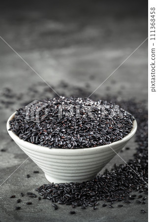 Put black rice in bowl Put black rice in bowl 111368458