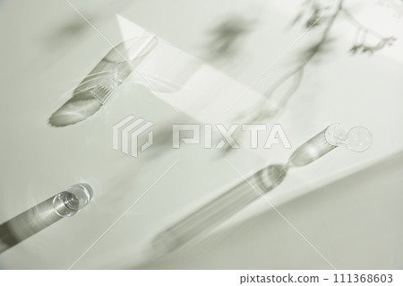 Natural texture of various glass cups on a table with sunlight streaming in. Natural texture of various glass cups on a table with sunlight streaming in. 111368603