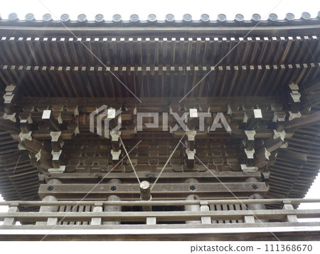 The wooden structure of the gate of Sesshu Garden 111368670